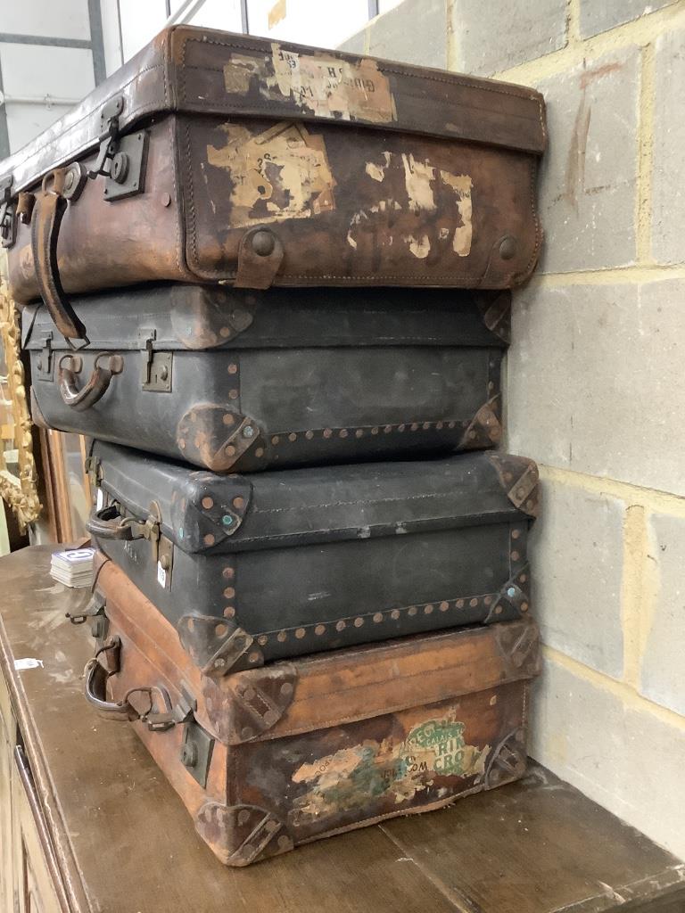 Four vintage leather cases, largest 68cm wide